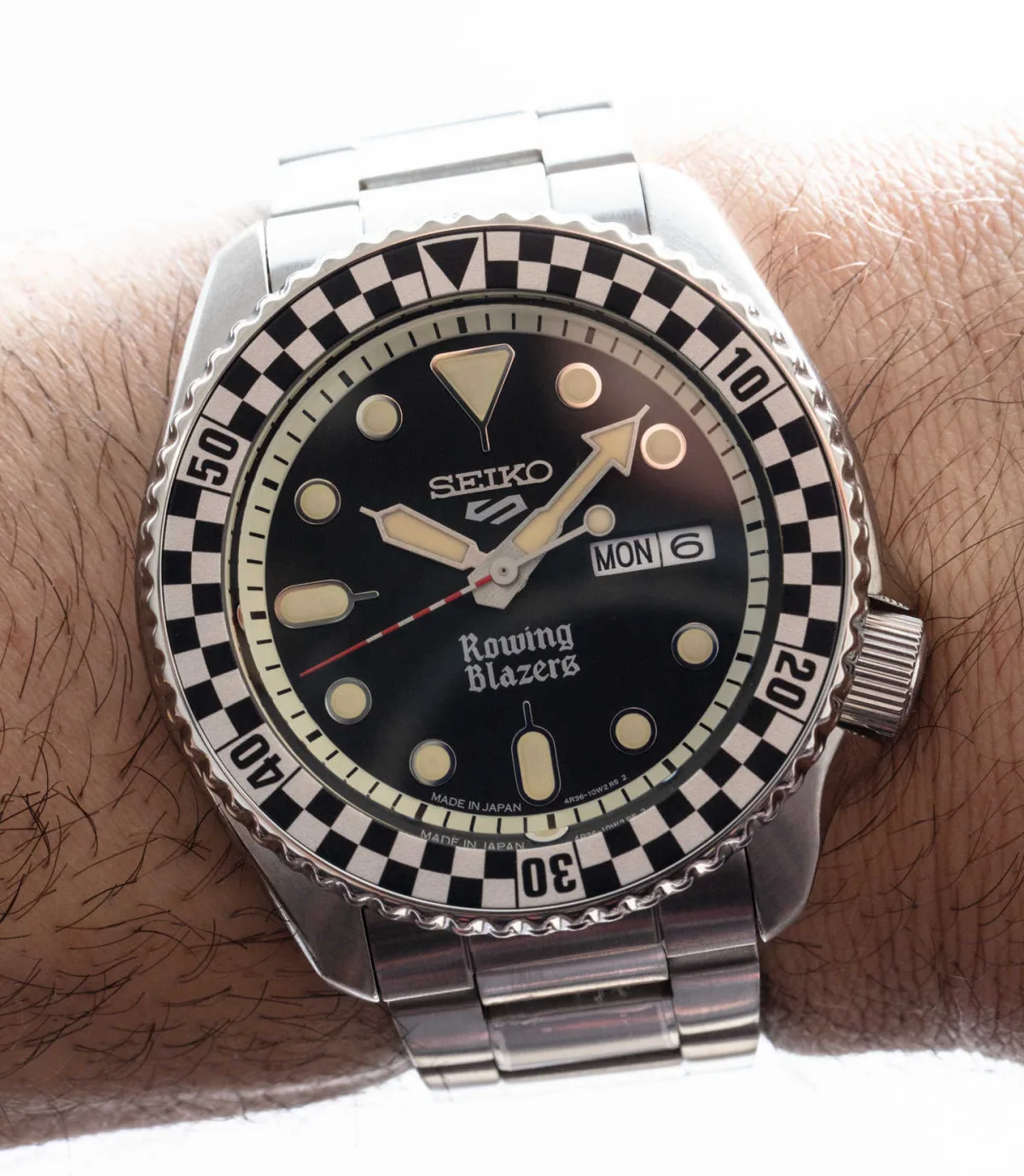 Close-up of Seiko 5 Sports x Rowing Blazers watch face.