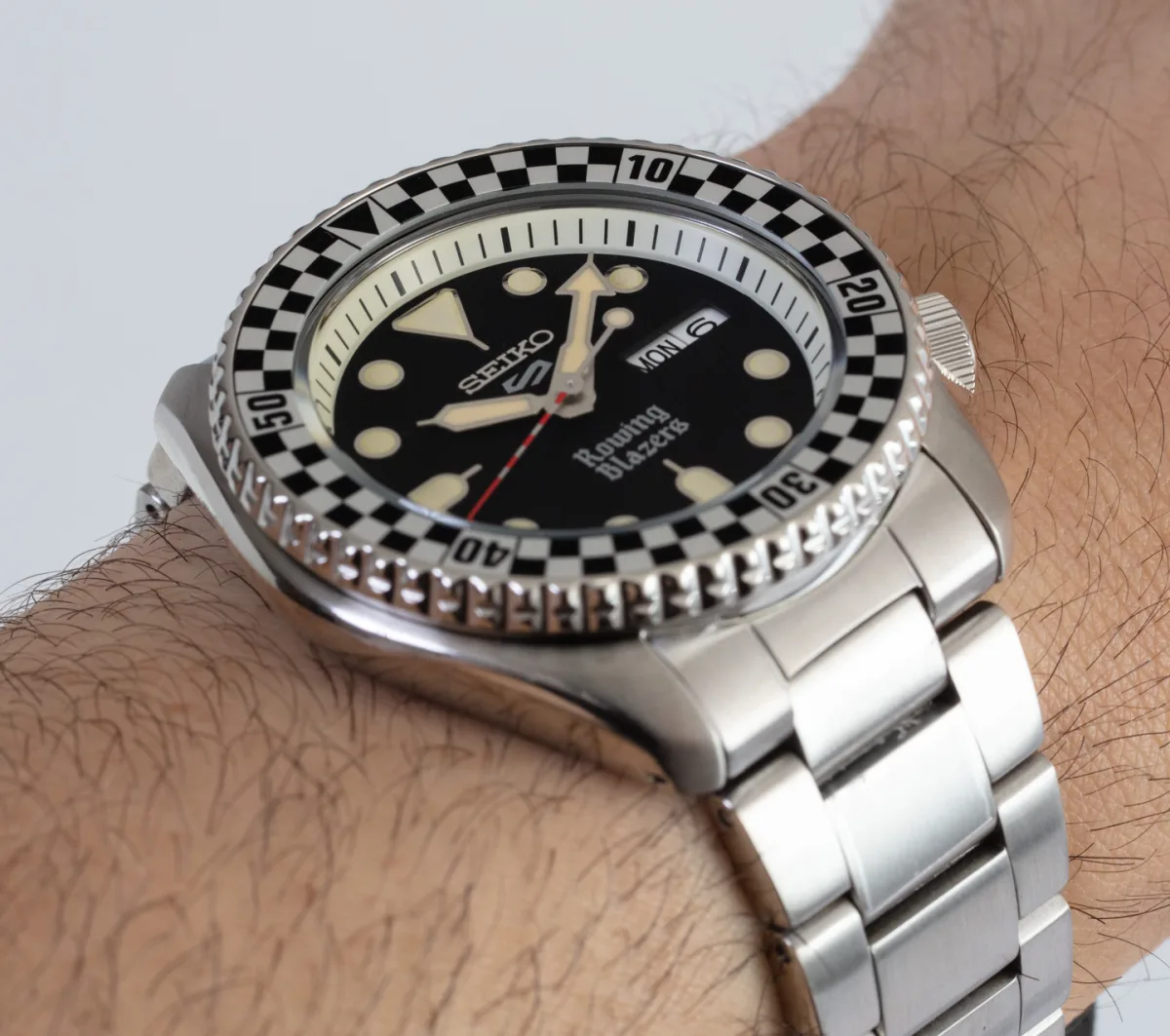 Multicolored striped strap with Seiko 5 Sports x Rowing Blazers SRPG51 model.