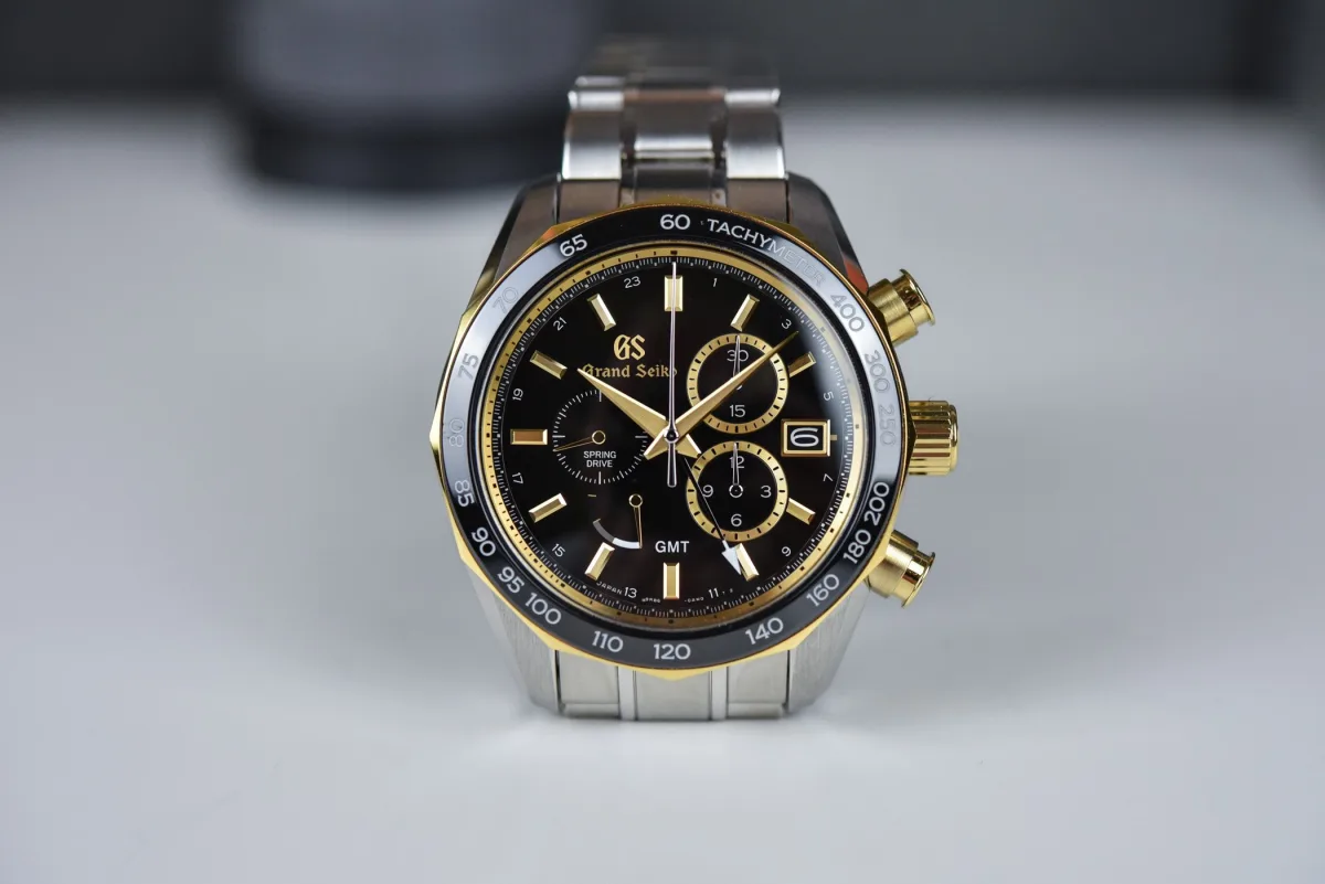 Side view of SBGC240 showcasing its gold bezel and crown