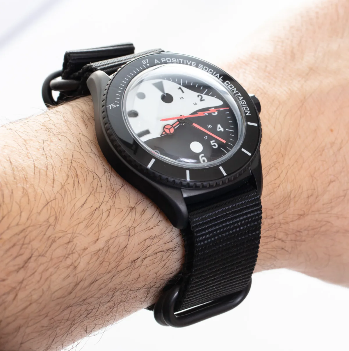 Close-up of UNDONE X STAPLE watch bezel with unique markings