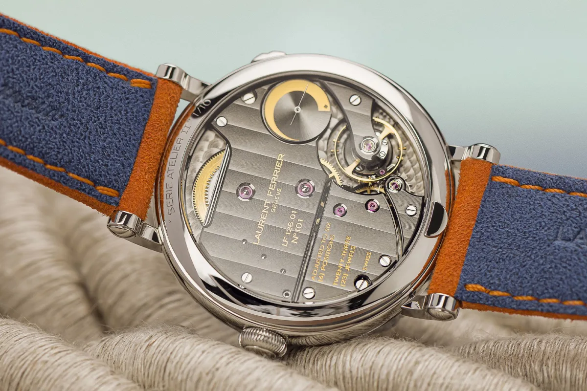 Close-up of the Montre Ecole Navy & Orange with orange leather strap