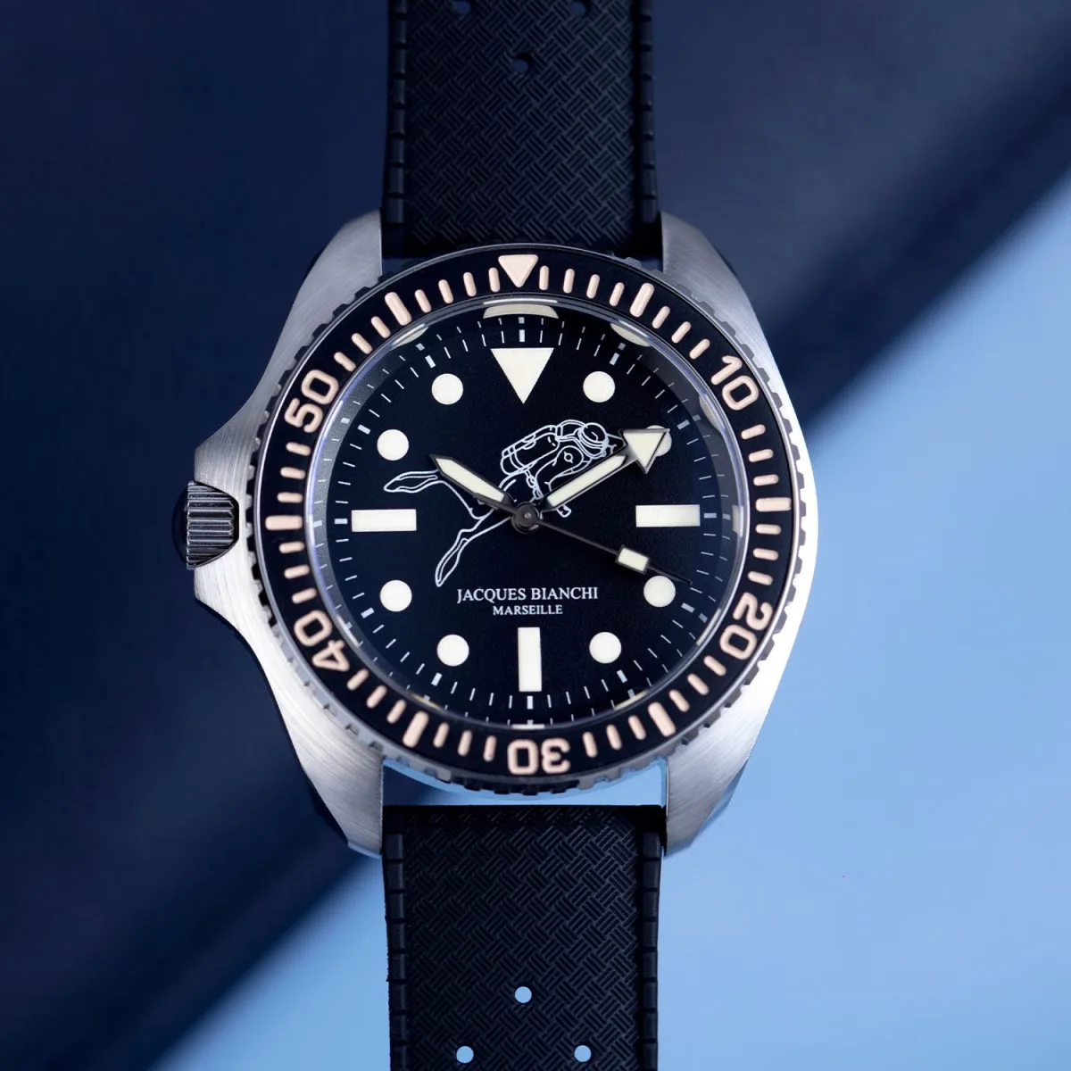 Close-up of Jacques Bianchi JB200 dial with diver silhouette