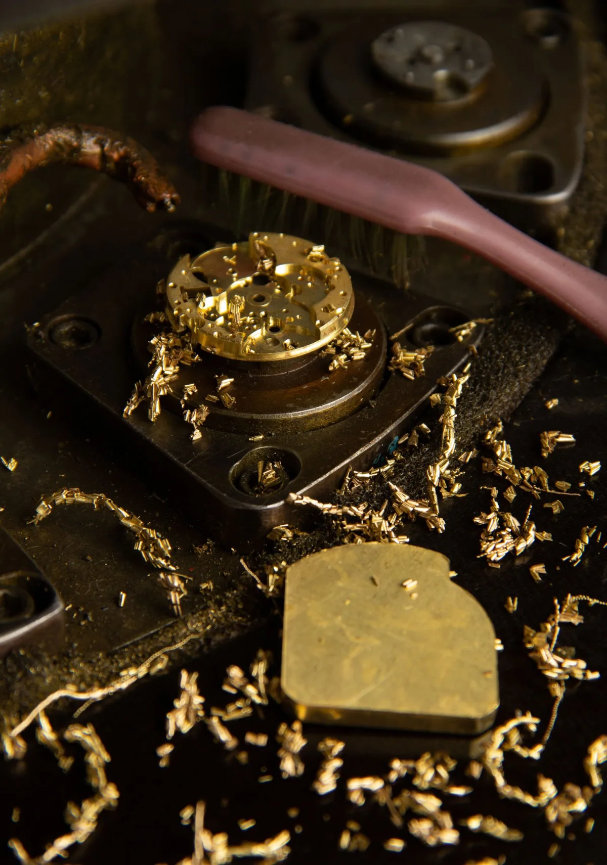 Raketa factory worker using a toothbrush