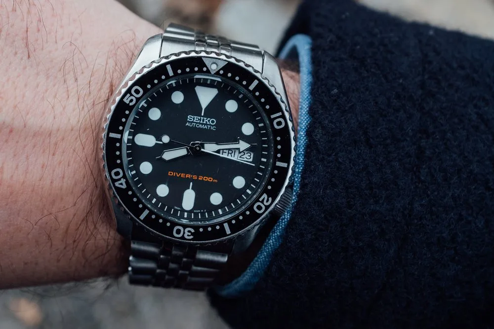 Seiko SKX007 watch with stainless steel case and luminous dial