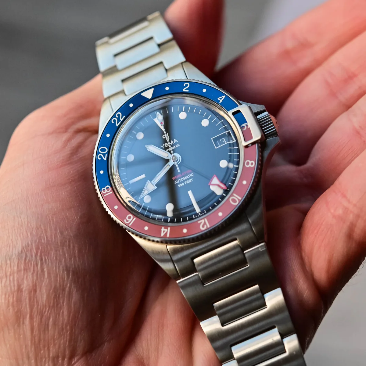 Close-up of Yema Superman Heritage GMT bezel