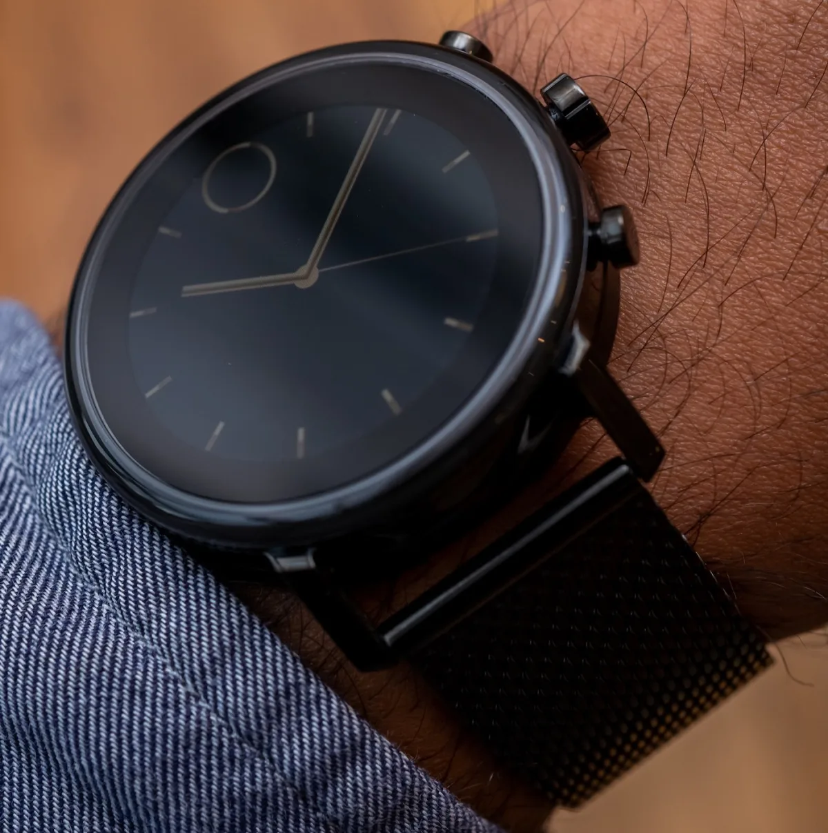 Movado Connect 2.0 on a magnetic charger