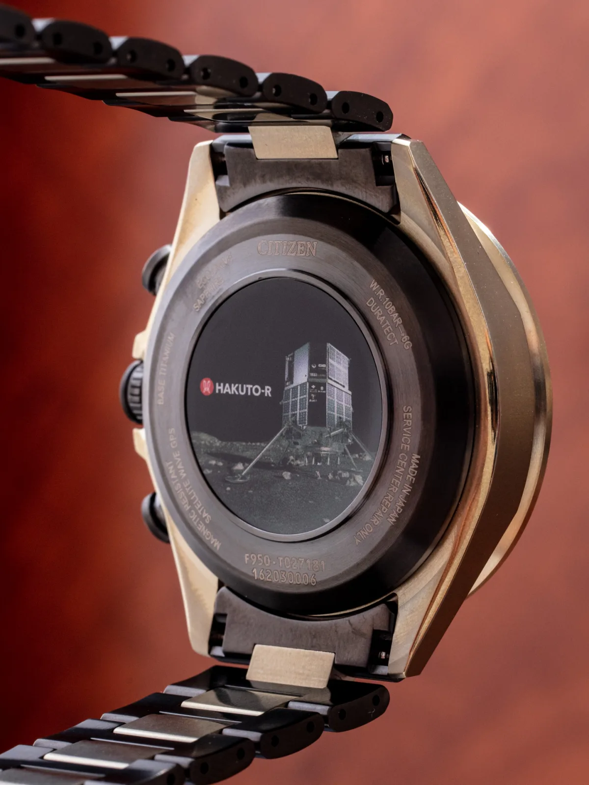 Back case of Citizen AT8185-71E showing Hakuto-R logo