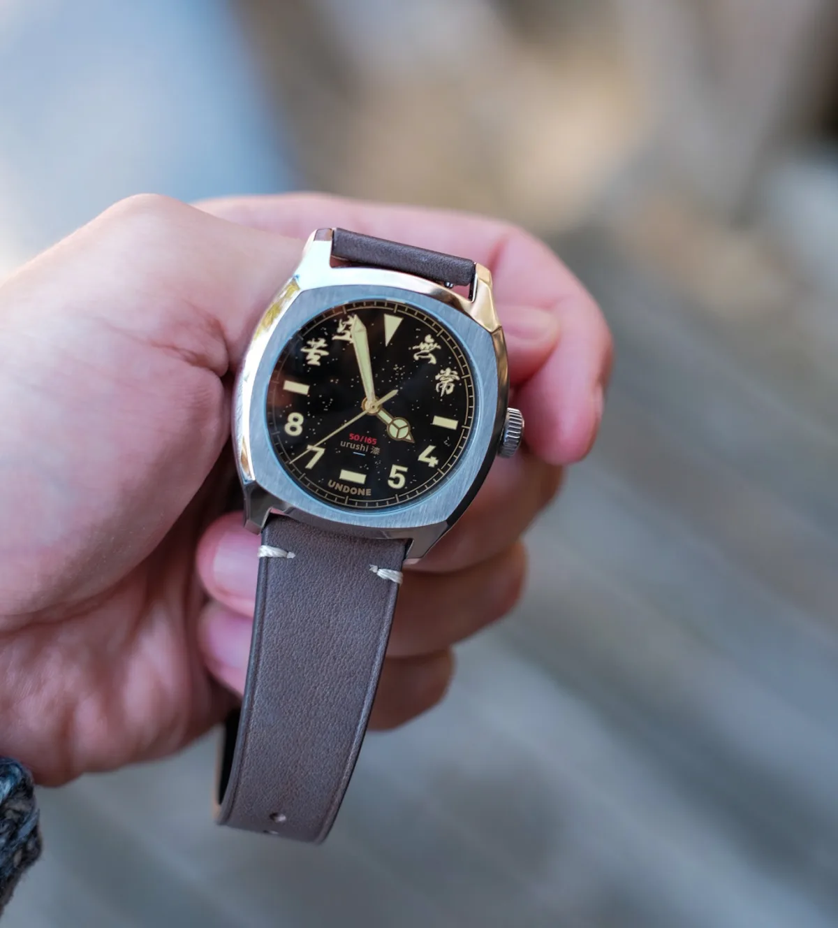 Close-up of the Undone X Simple Union Urushi watch face