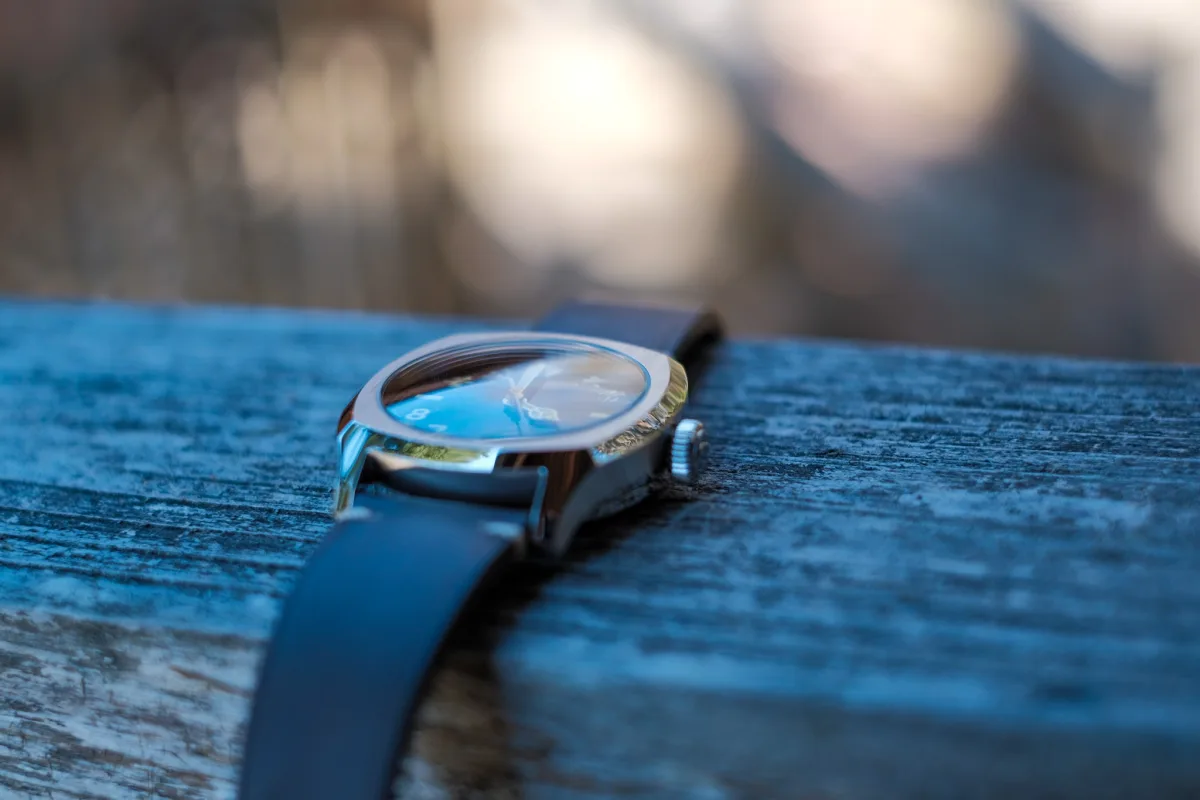 Side view of the Urushi watch case and crown
