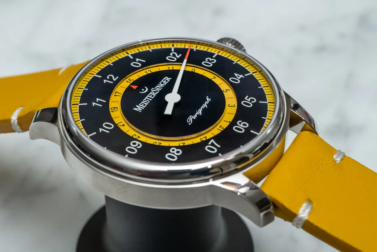 Close-up of blue dial with yellow accents