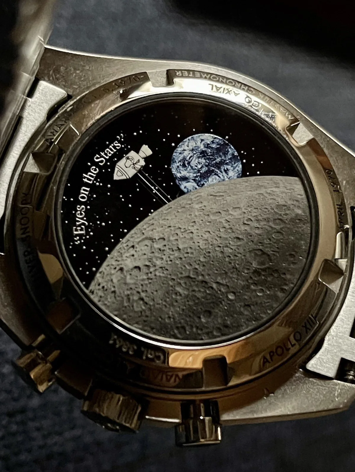 Close-up of Omega Speedmaster Silver Snoopy Award dial