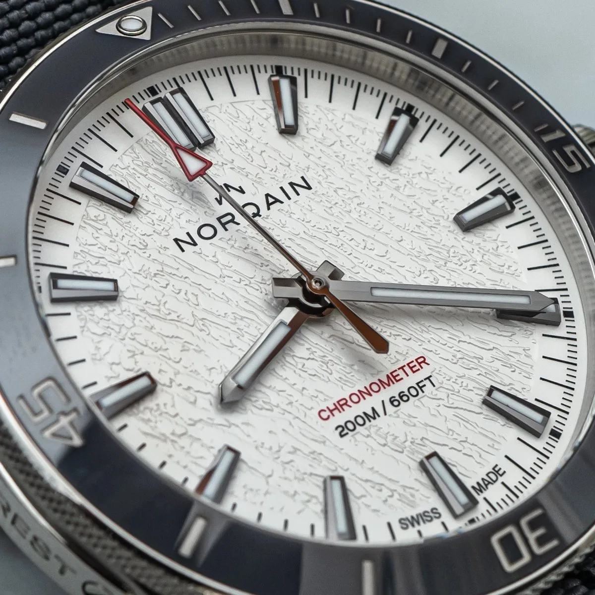 NORQAIN Adventure NEVEREST glacier dial with red second hand