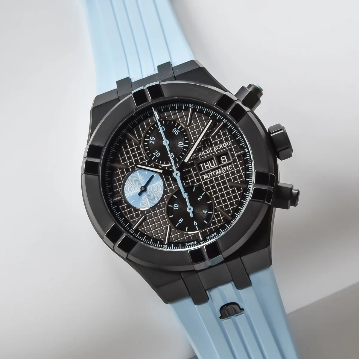 Close-up of dial with light blue accents and chronograph sub-dials