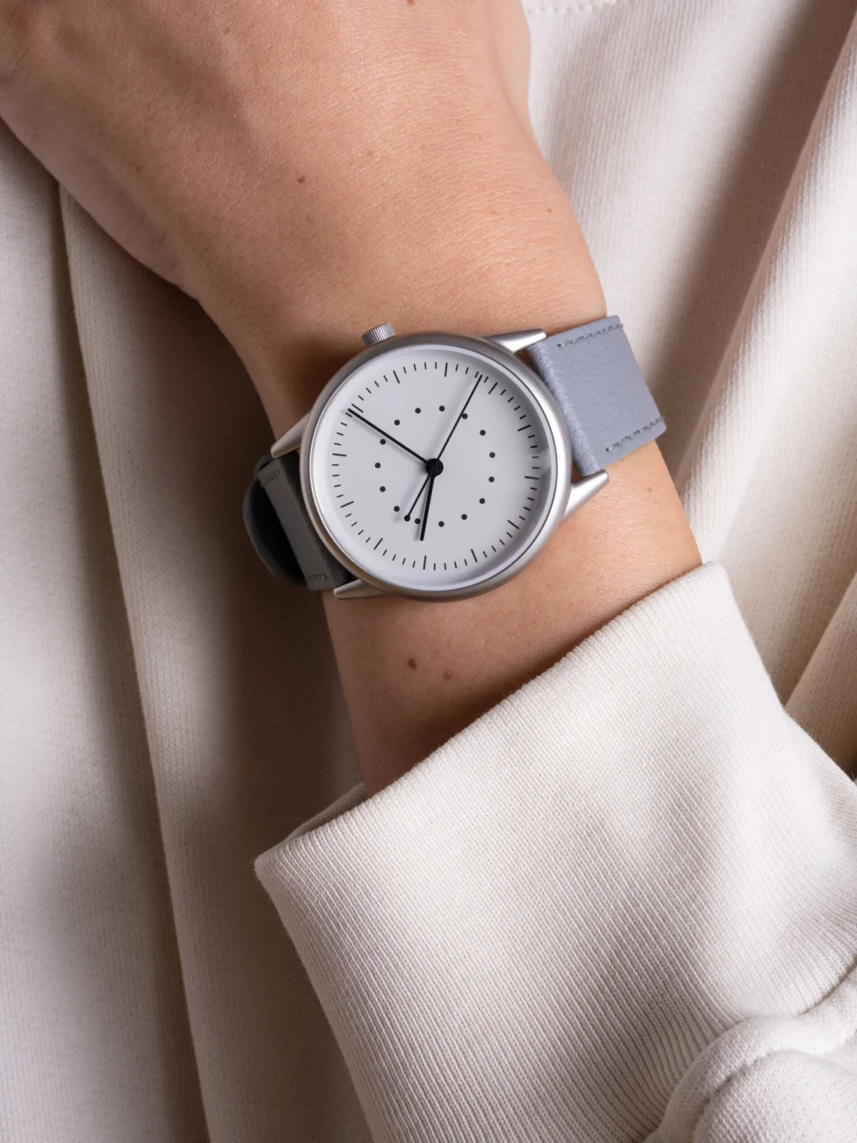 Three monochrome dials of the Mudita Moment watch