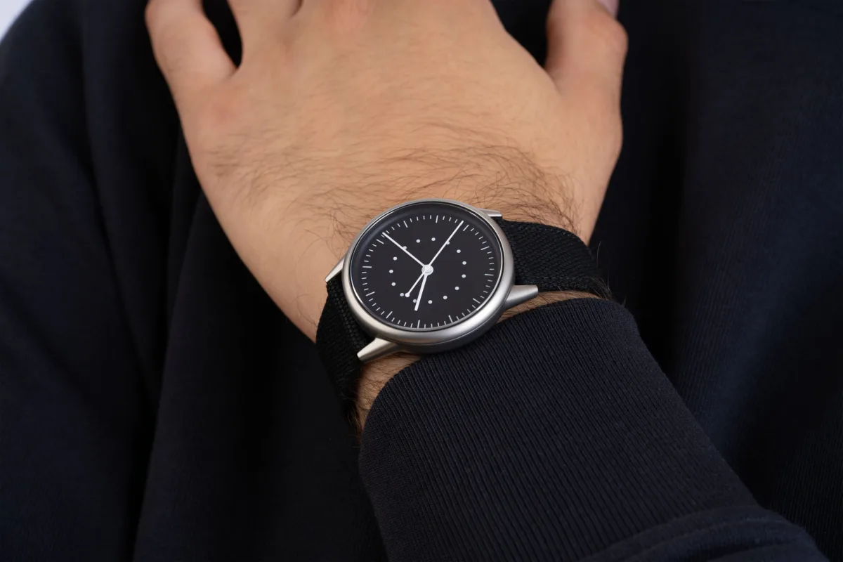 Close-up of the Mudita Moment watch dial with hands