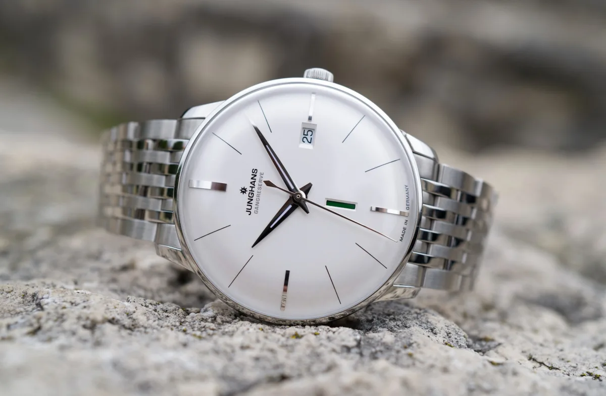 Early Junghans watch components and bronze plaques