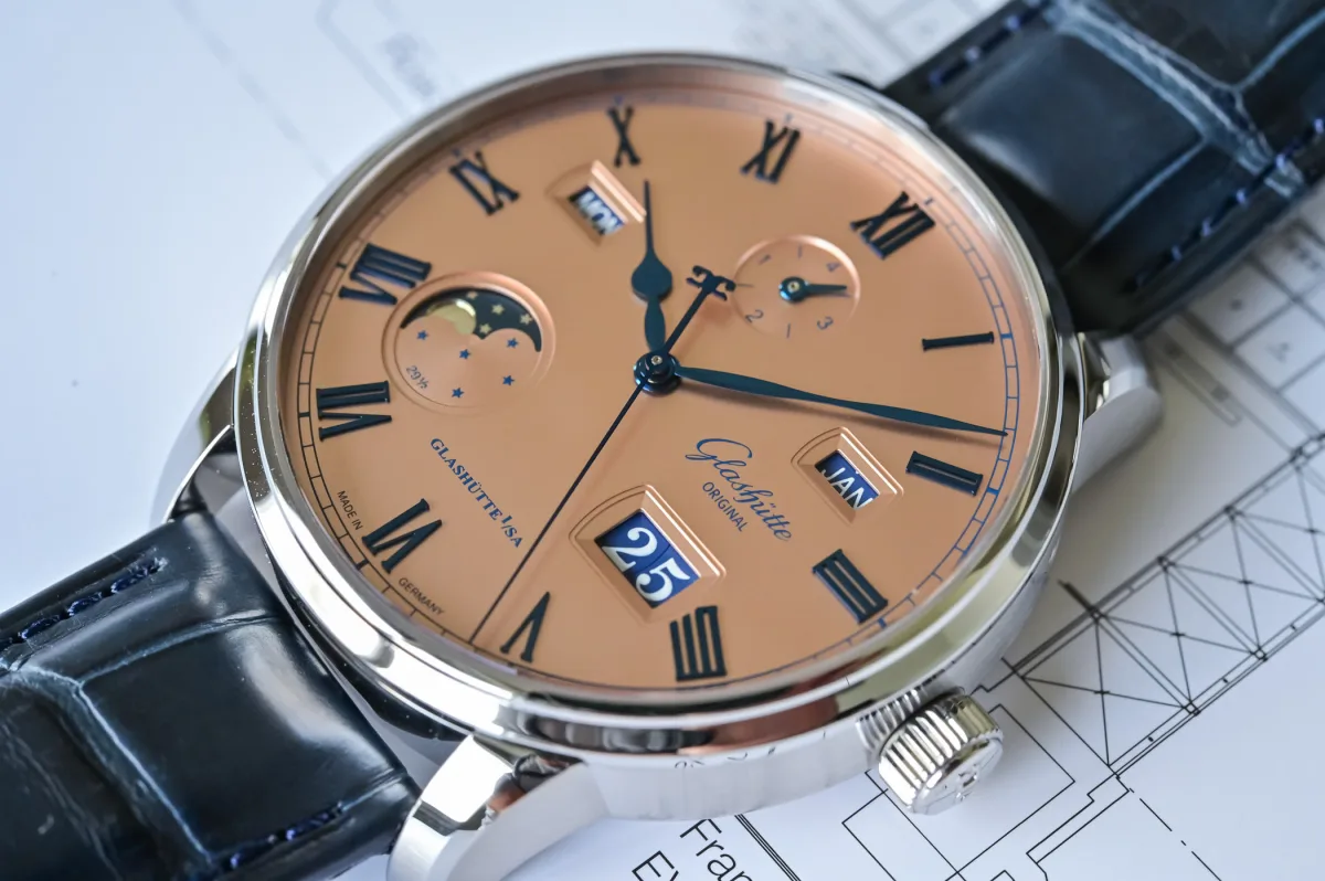 Dial with blue Roman numerals and hands