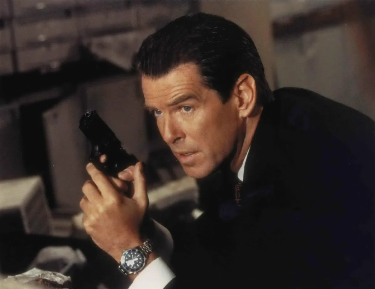Pierce Brosnan detonating a bomb with OMEGA watch.