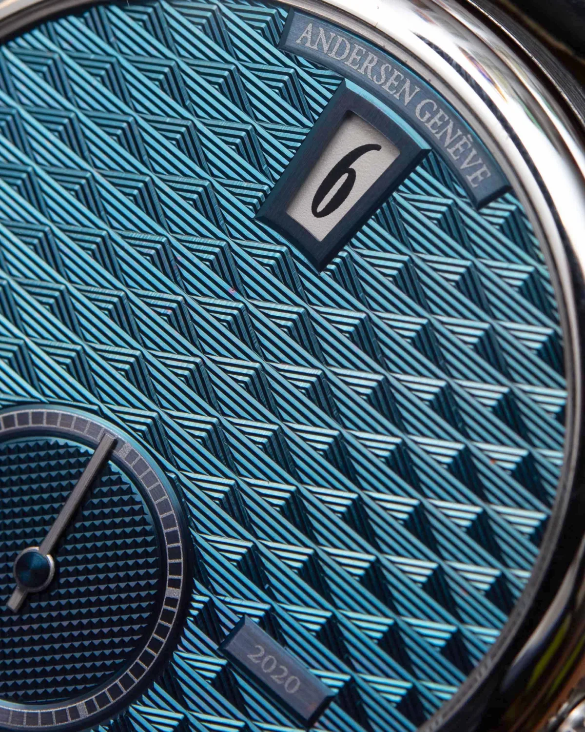 BlueGold ring with engraved text on Andersen Geneve watch.