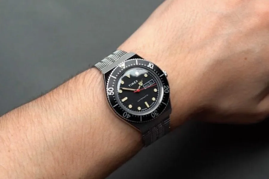Timex M79 Automatic watch on a wrist, showcasing its size.