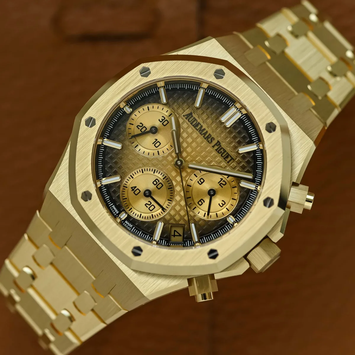 Close-up of gradient yellow gold dial with subdials