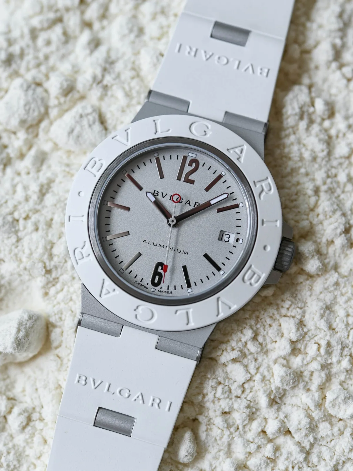 Close-up of Bulgari Aluminio watch with dual branding on bezel