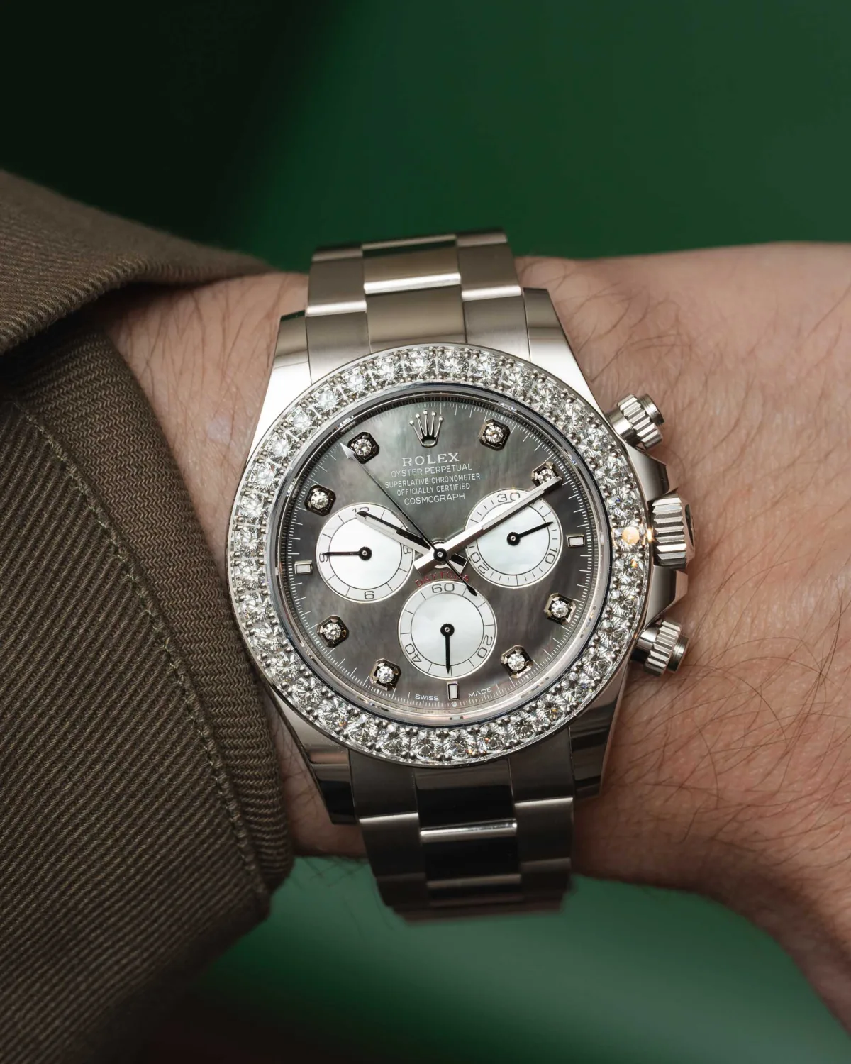 Rolex Daytona worn on wrist, showcasing diamonds