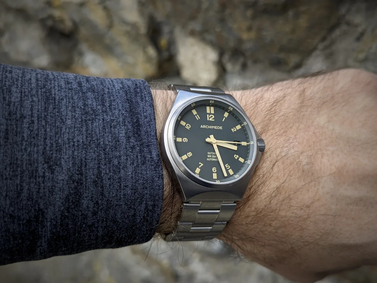Close-up of Archimede watch dial with olive color