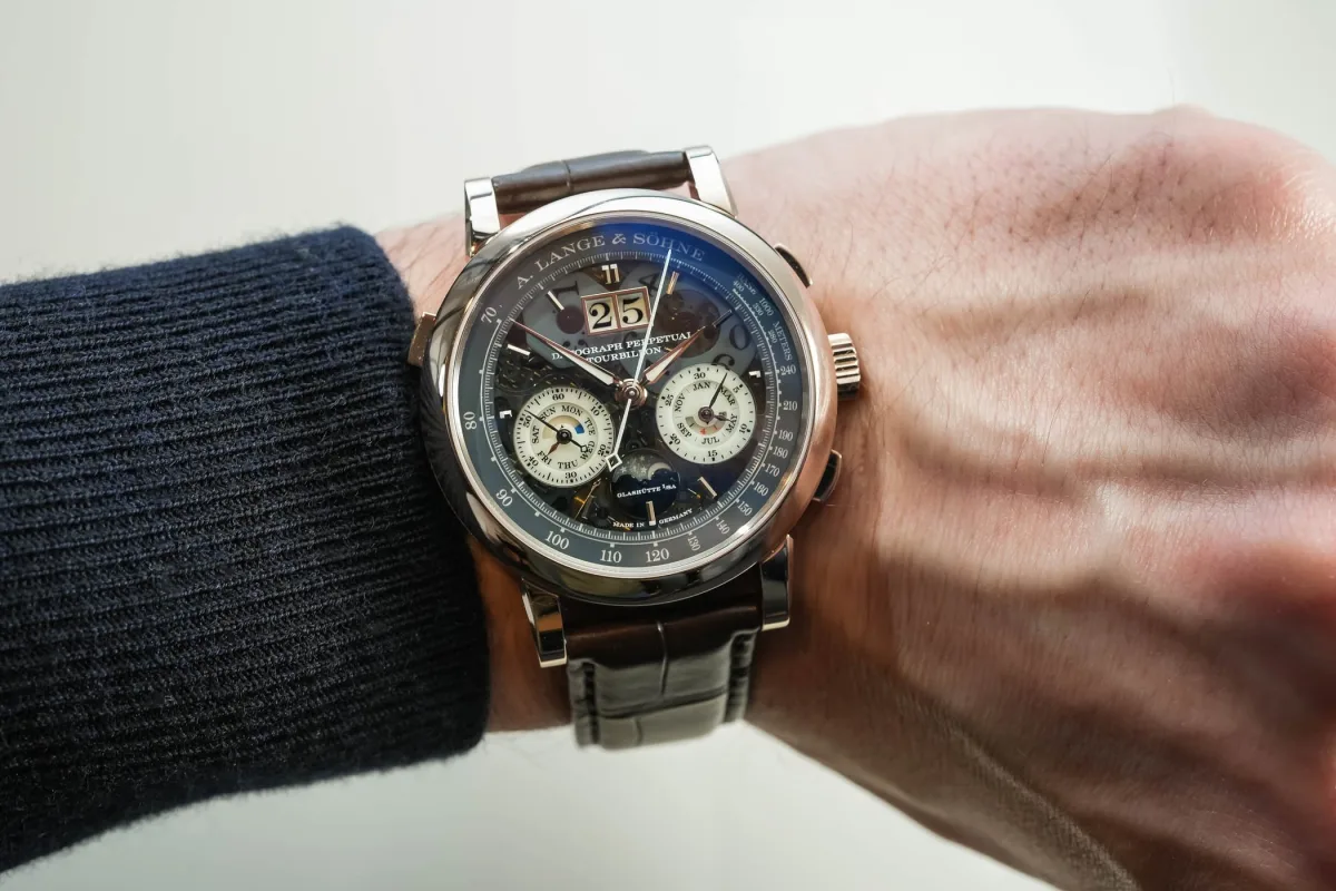 A. Lange & Söhne Datograph Perpetual Tourbillon Lumen watch showcasing its honey gold case and sapphire dial.