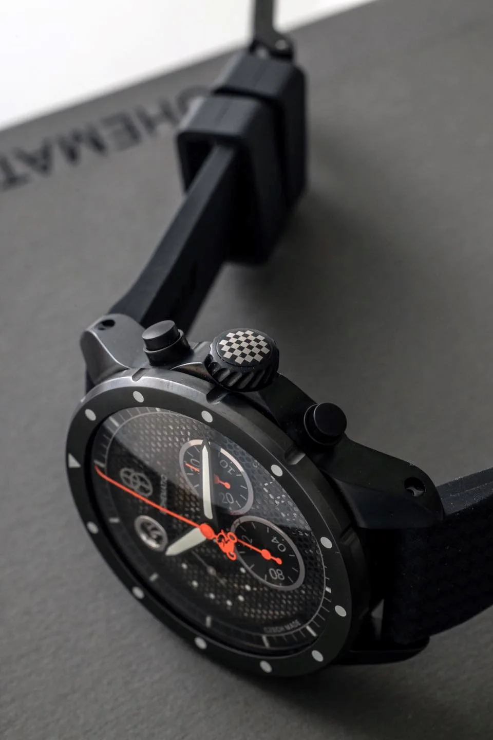Minor chronograph watch with asymmetrical design