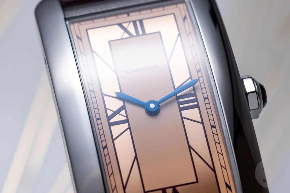 Close-up of Cartier Tank Américaine's crown and ruby detail