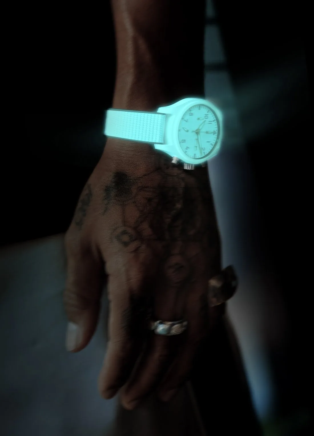 Close-up of luminous IWC watch in the dark