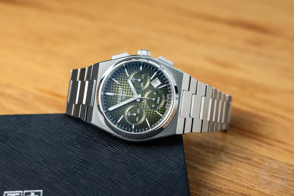 Tissot PRX with dark green dial on wrist