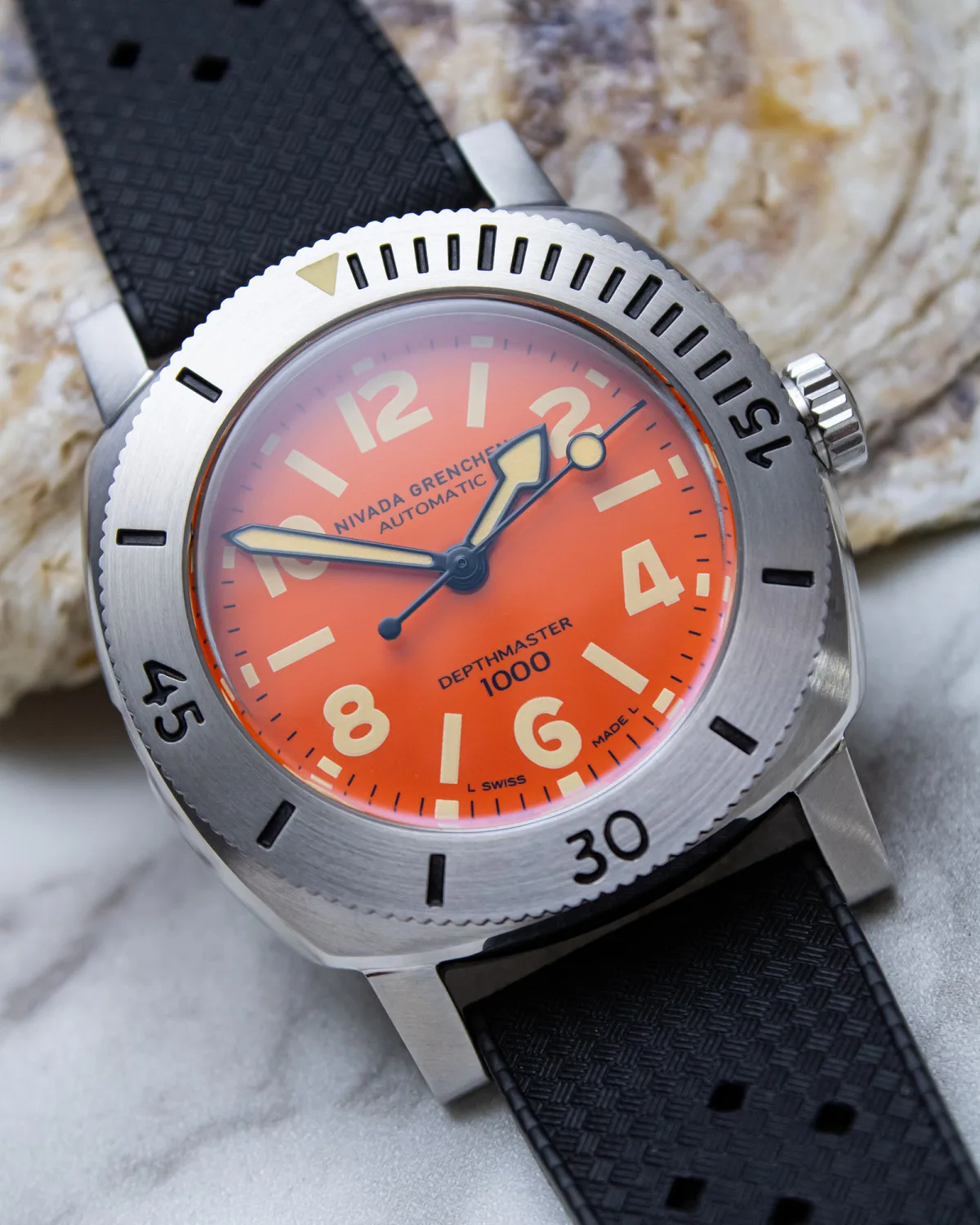 Close-up of Nivada Grenchen Depthmaster Orange dial