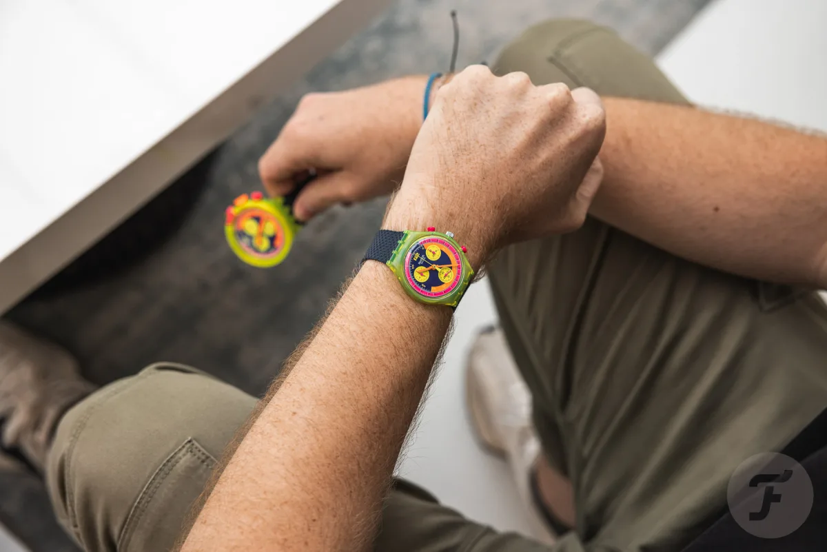 Holding Swatch Neon To the Max watch