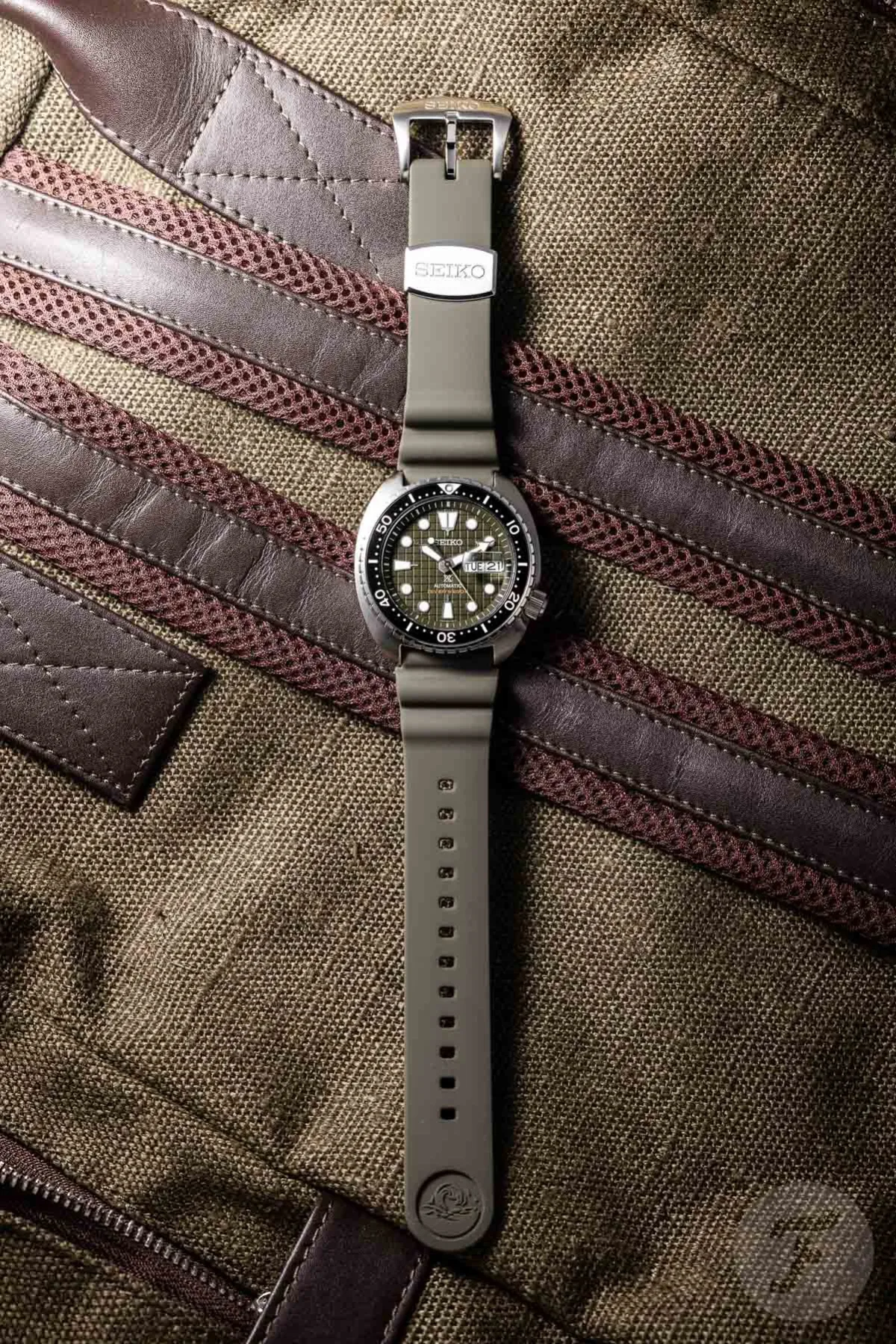 Seiko SRPE05 King Turtle with a magnifying lens over the date