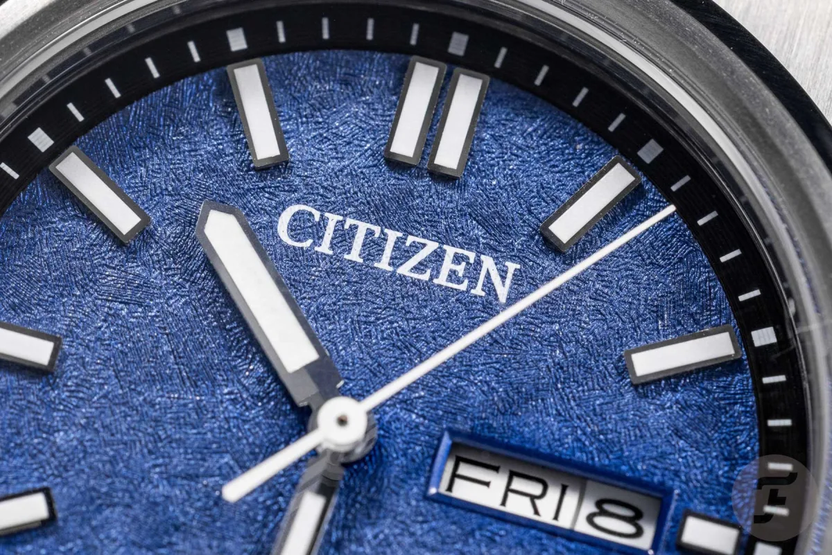 Close-up of Citizen Super Titanium Eco-Drive Day-Date watch dial