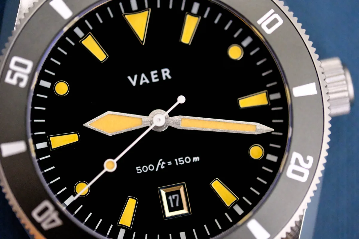 Close-up of Vaer DS2 Arctic dial and luminescent markers