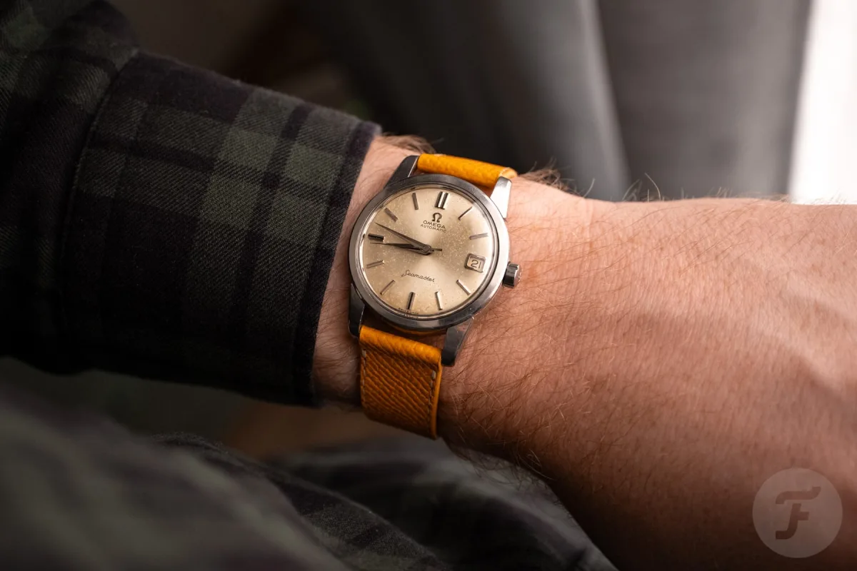 Hands holding a vintage watch