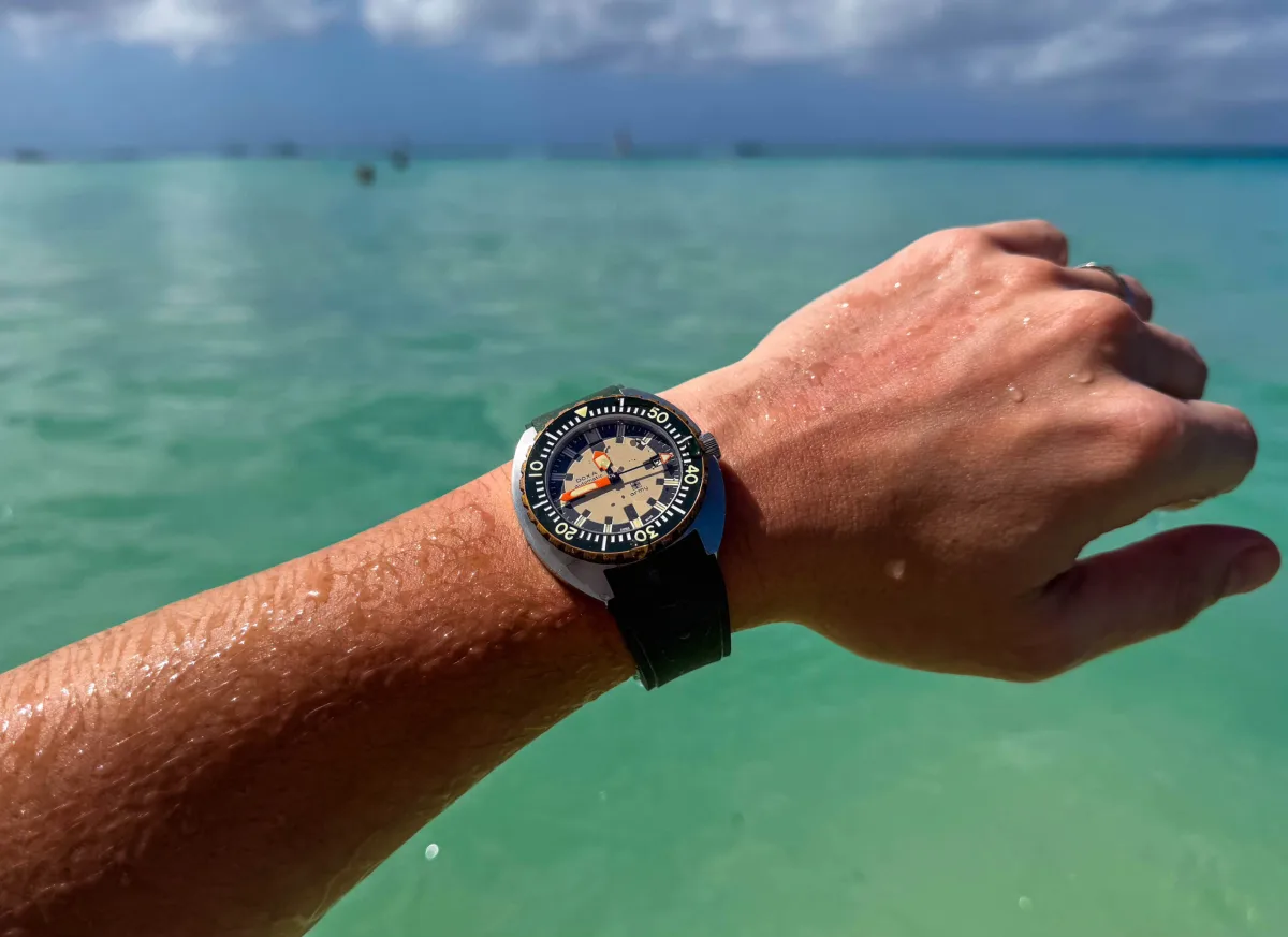 Snorkeling in turquoise water with Doxa Army