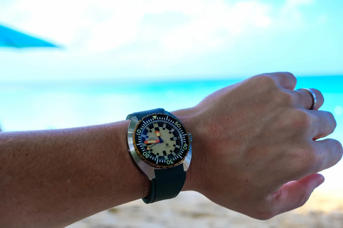 Doxa Army watch under a palm tree