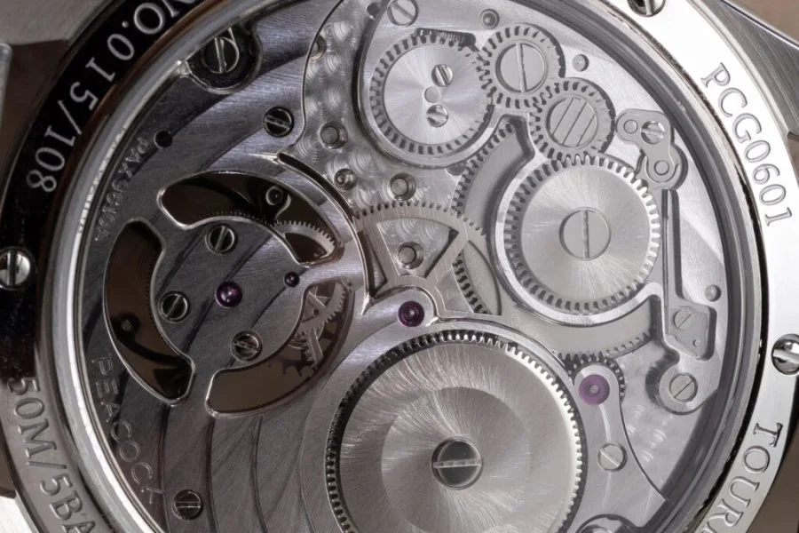 Peacock PAX9610A movement viewed through sapphire case back.