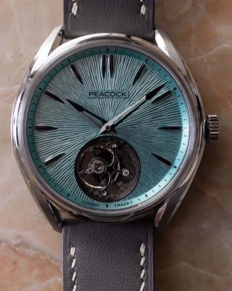 Hand-engraved dial of Peacock Divine Craft with micro-engraving.