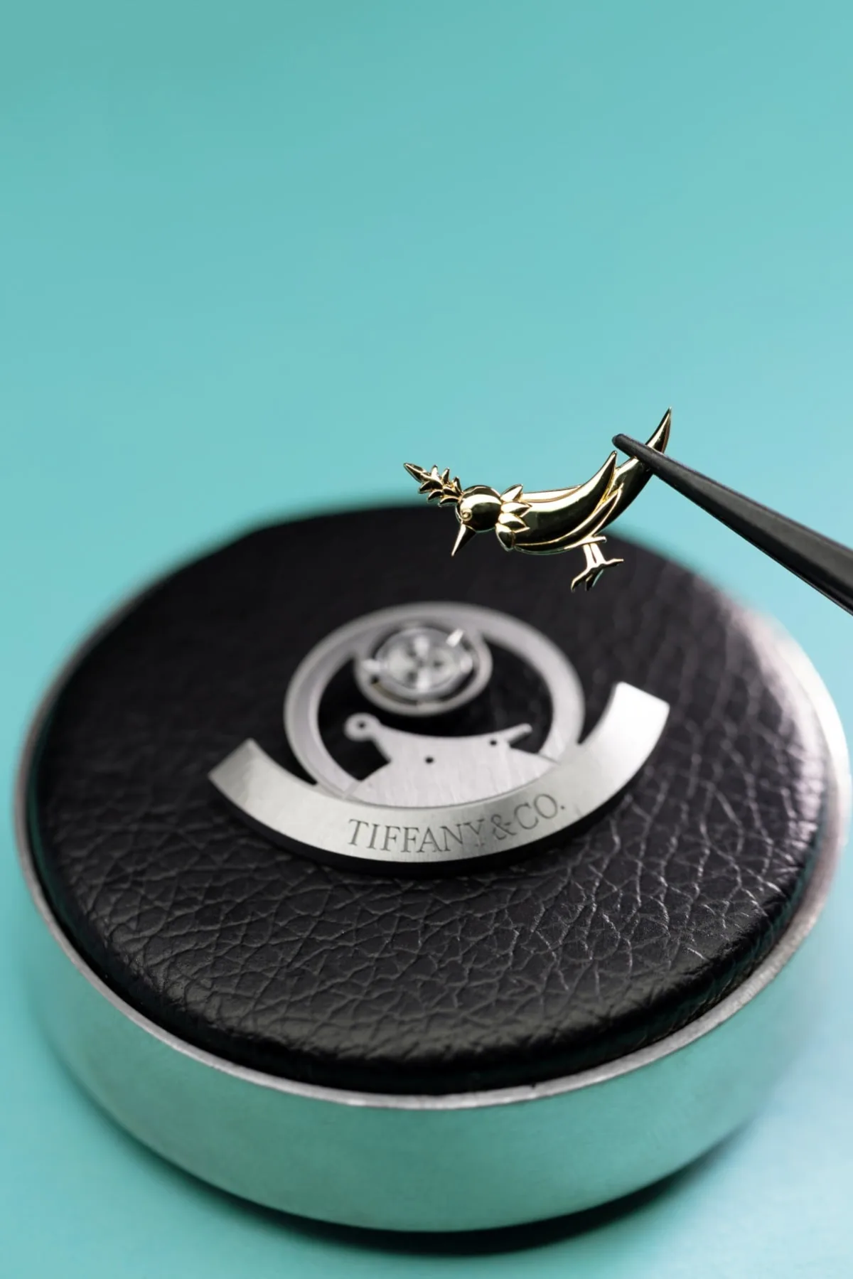 Tiffany & Co. Tiffany Timer with customized rotor and bird figure.