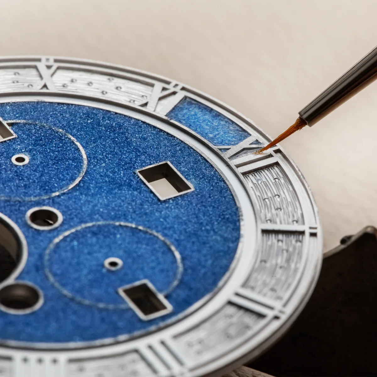 Hand-engraved Roman numerals on the watch
