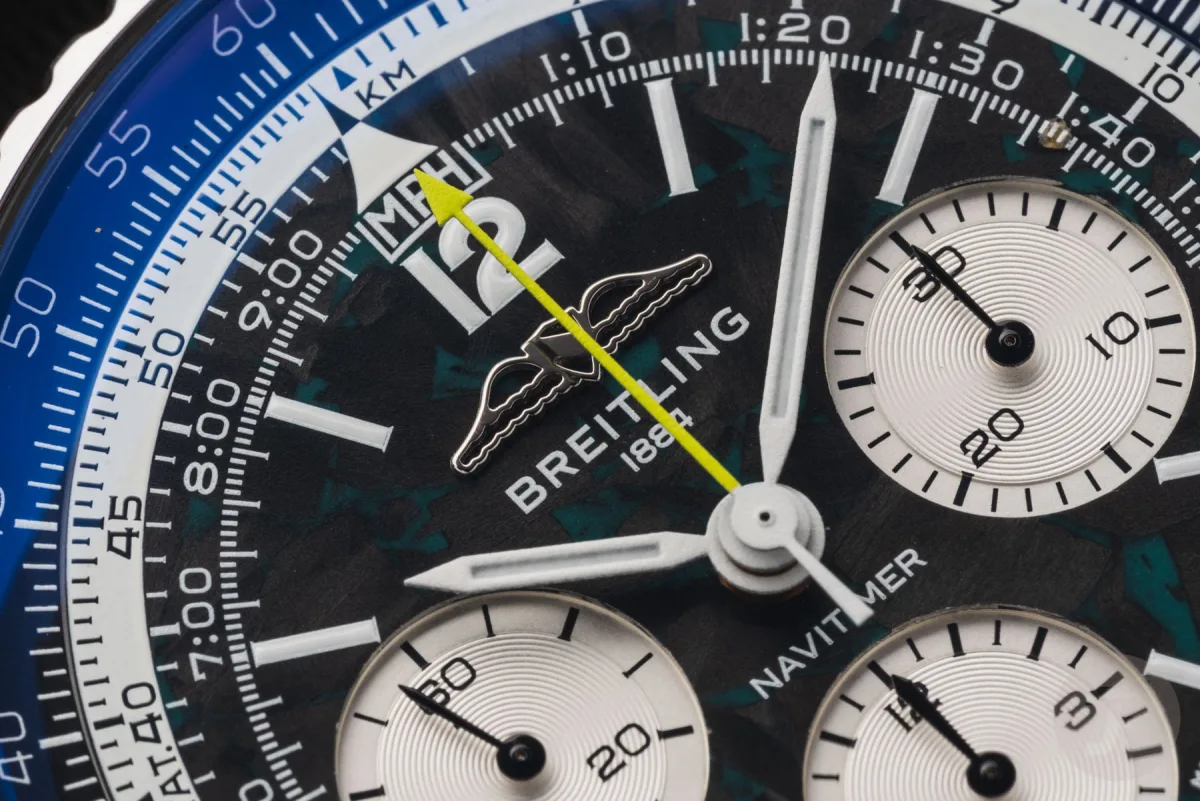Titanium rotor with Aston Martin logo on Breitling Navitimer