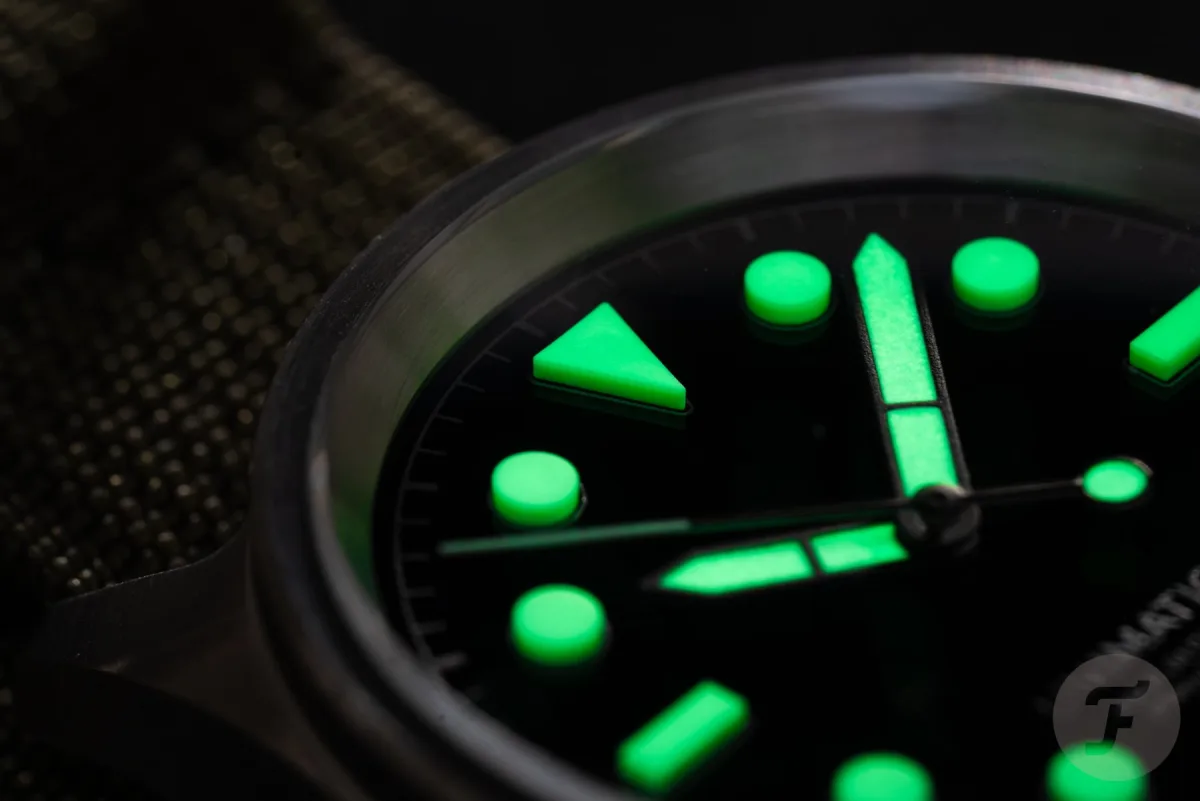 Matte black dial with 3D Unilight indices on Unimatic watch