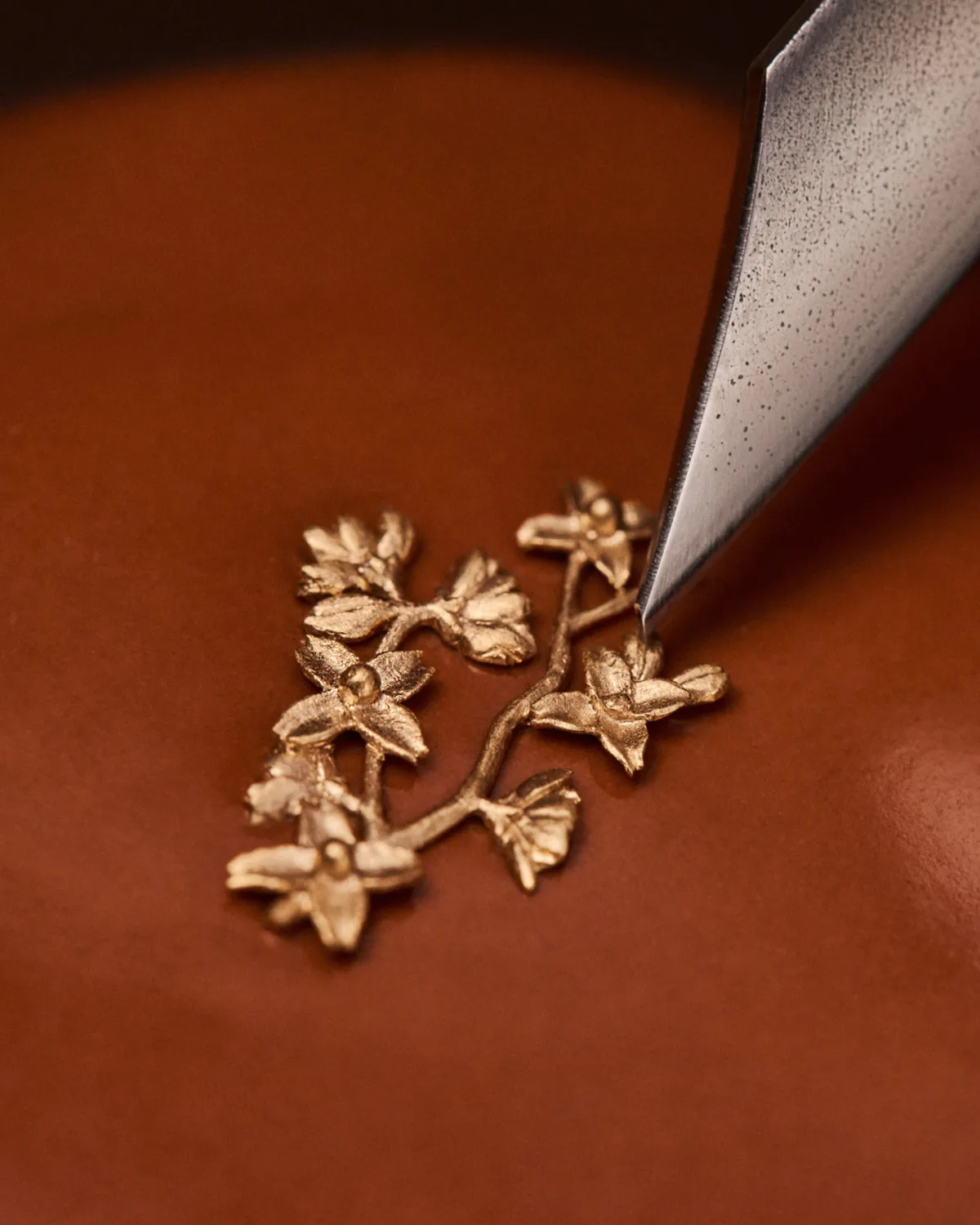 Gold sakura branches with pink Louis Vuitton monogram flowers.