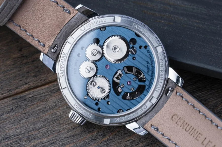 Peacock movement description with blue accents