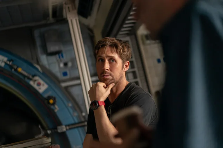 Ryan Gosling analyzing data in the spacecraft